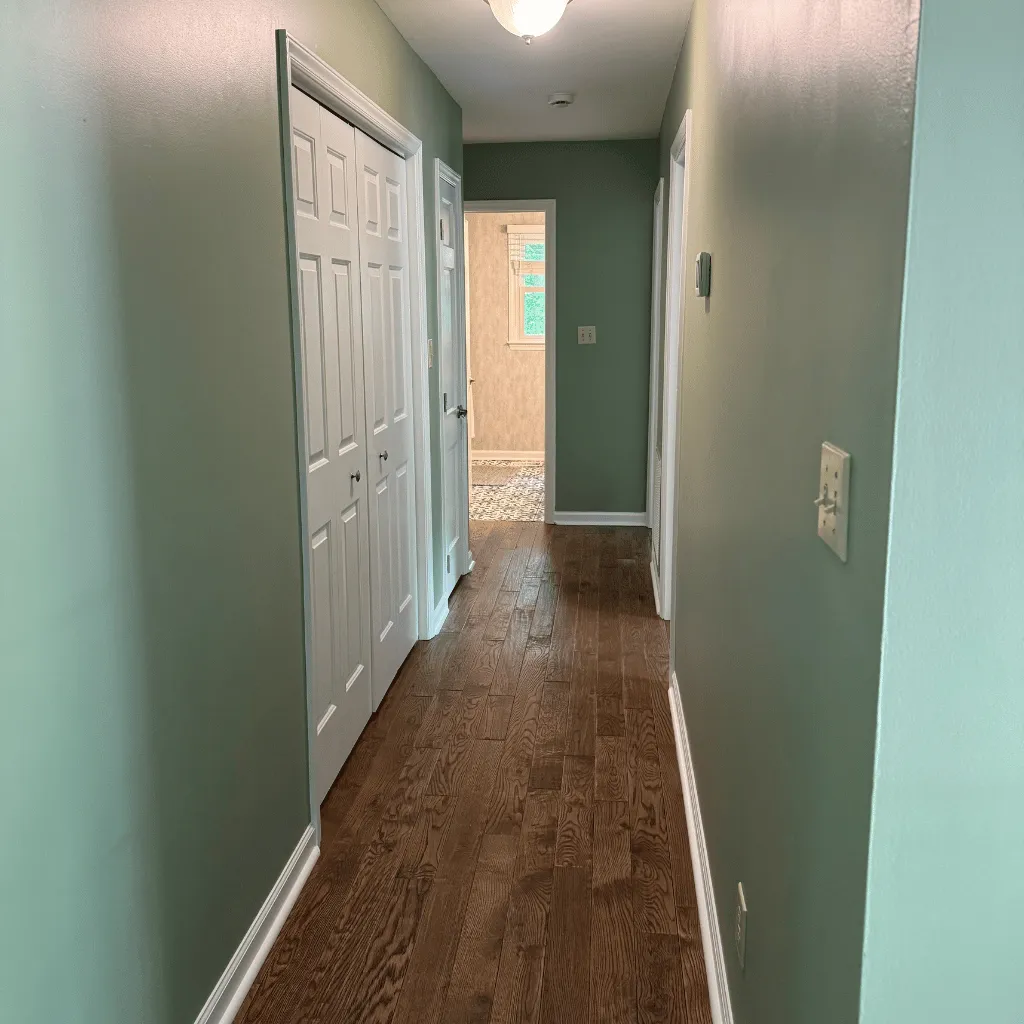 Freshly cleaned hallway with hardwood floors